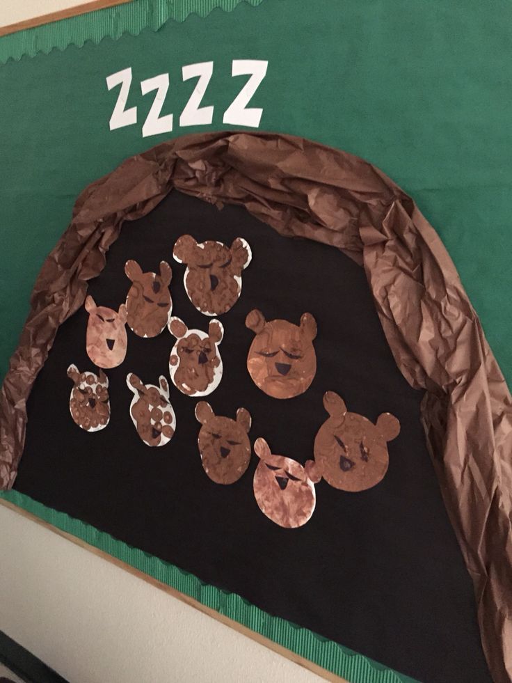 a bulletin board with teddy bears on it and the numbers 1232 - 2 in front of them