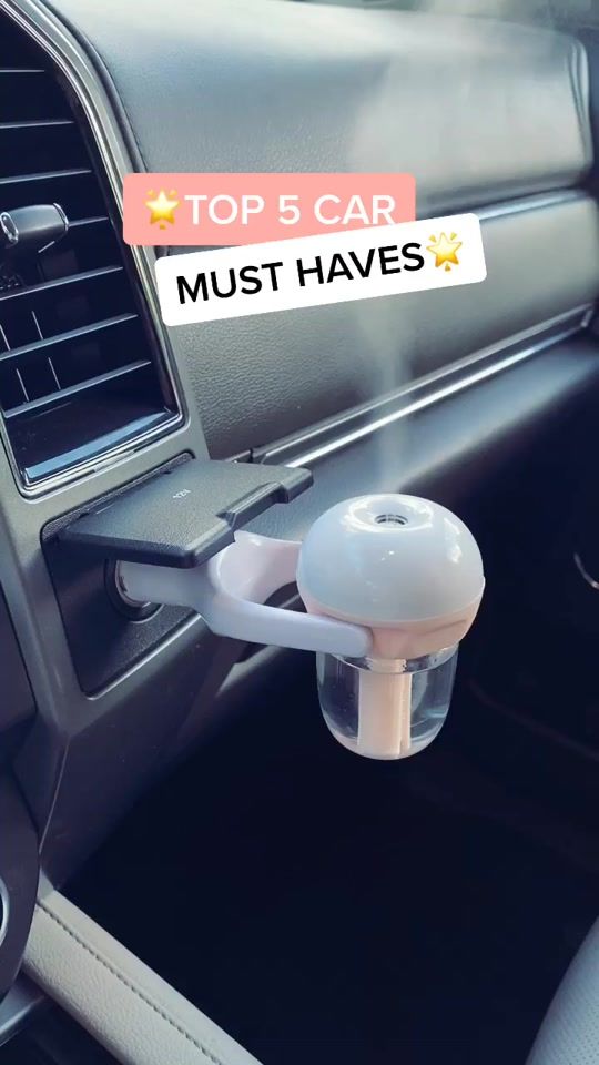 an air vent in the center console of a car with top 5 car must haves sticker on it