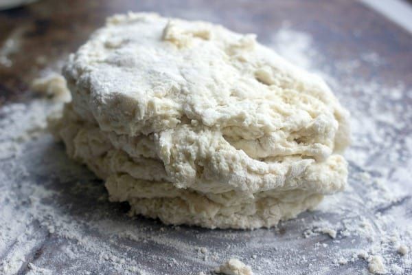 a pile of dough sitting on top of a metal pan