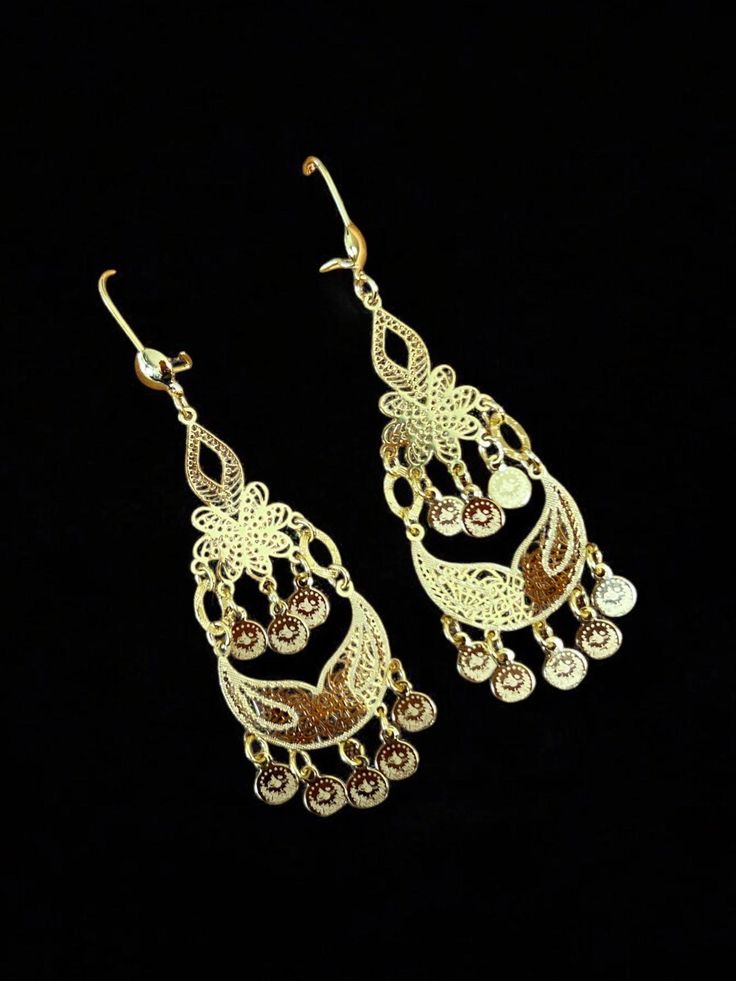 These elegant Telfit Drop gold earrings are light weight yet make a statement at three inches long. The perfect addition to any outfit for a touch of sophistication and style. Crafted with expert precision, these earrings are sure to elevate your look. Elegant Metal Linear Earrings For Evening, Elegant Rose Gold Metal Clip-on Earrings, Elegant Yellow Gold Chandelier Earrings, Gold-tone Dangle Chandelier Earrings For Formal Occasions, Elegant Metal Linear Earrings For Formal Occasions, Elegant Bridal Earrings With Intricate Metal Design, Vintage Filigree Drop Earrings For Evening, Vintage Style Filigree Drop Earrings For Evening, Elegant Gold-tone Jewelry With Filigree