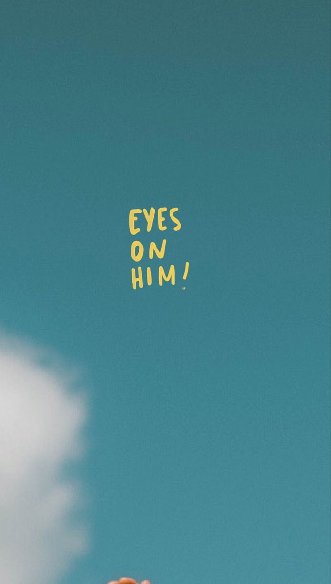 a person holding up a yellow sign that says eyes on him in the sky above them