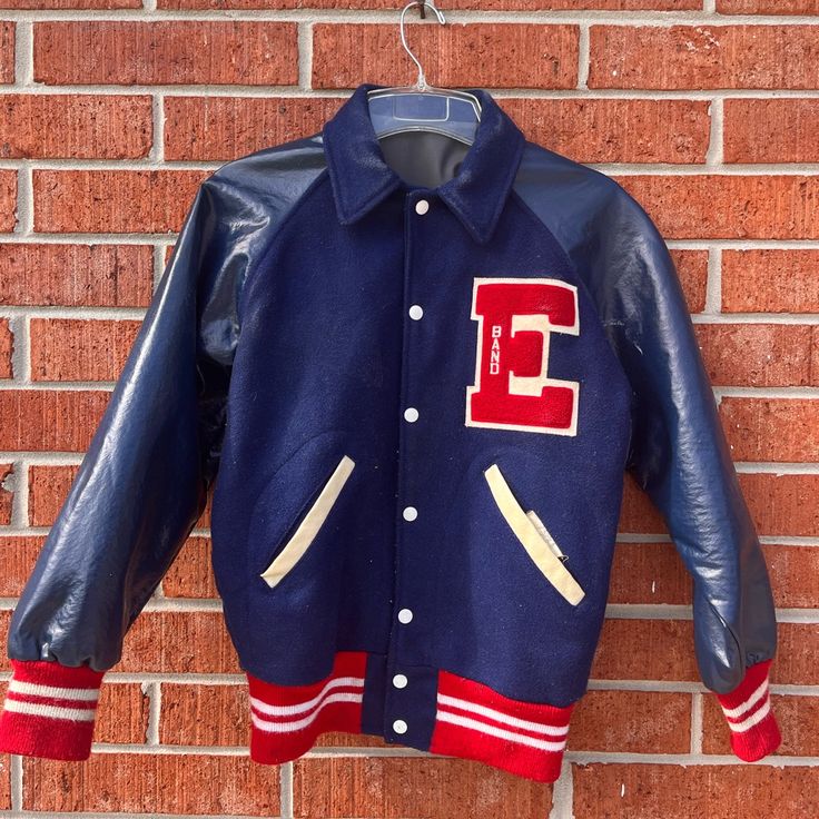 Red & Navy Varsity Jacket For A Band Member From The 70s, Pointy Collar, Size M Retro College Outerwear With Button Closure, Retro Outerwear With Button Closure For College, Retro Varsity Jacket With Button Closure For Winter, Navy Fitted Retro Outerwear, Fitted Navy Retro Outerwear, American Retro Long Sleeve Outerwear For Fall, Red Retro Outerwear With Pockets, Retro Red Outerwear With Pockets, Retro Outerwear With Pockets For College