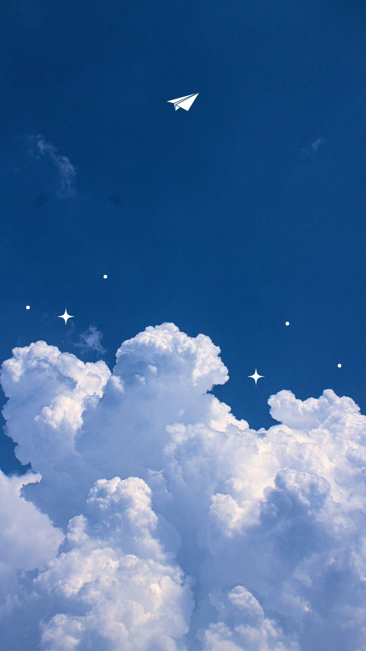 an airplane is flying high in the sky with stars and clouds around it on a sunny day