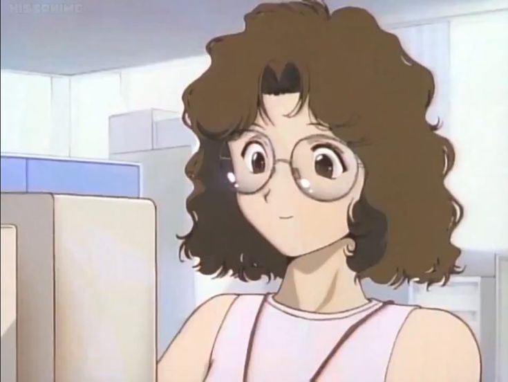 a woman with glasses looking at something in front of her face while standing next to a refrigerator