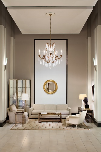 a living room filled with furniture and a chandelier