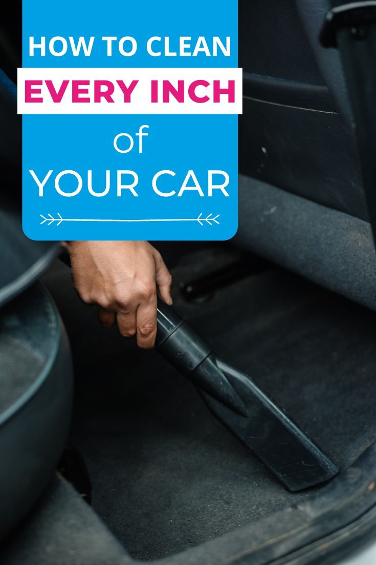 a person cleaning the inside of a car with a blue sign that says how to clean every inch of your car