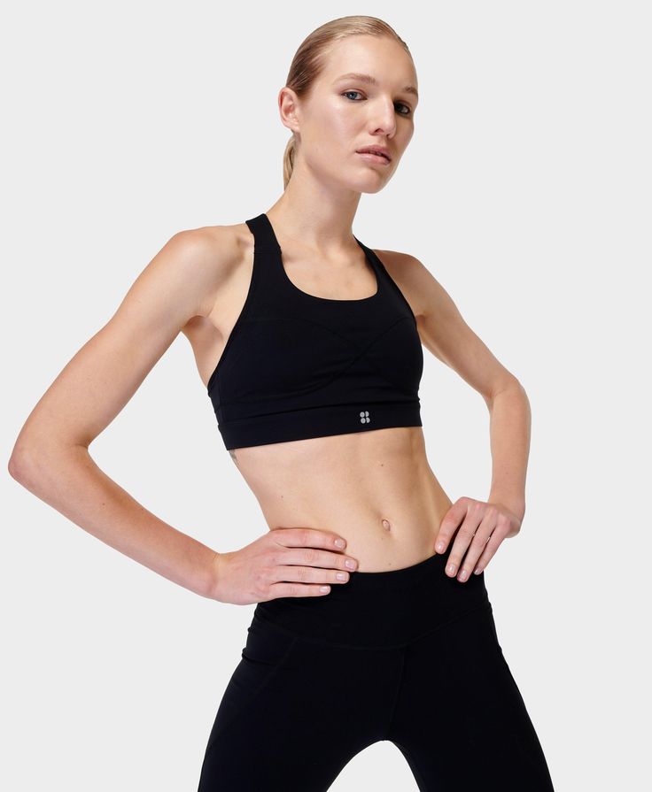 Our bestselling Power Bra with a new and improved fit. Stretchy, sweat-wicking and quick-drying. Flattering new scoop neck and looped back with an adjustable T-bar strap. Medium impact design engineered for comfort and support with removable pads. Contour infinity seamlines match the detail on the Power High Waist Leggings. For the best fit, we recommend sizing down. Model wears size S and is 178cm/5'10" tall. Style Code: SB8993Colour: Black Impact Design, Gym Bra, Medium Support Sports Bra, High Intensity Workout, Sweaty Betty, New And Improved, Support Bras, Sport Bra, Black Sports Bra