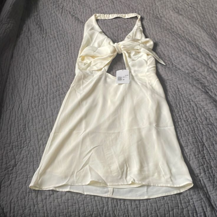 Nwt Perfect For Bride To Be On Her Bach! Halter Neck With Open Back, Deep V And Bow That Ties Across The Chest. Zipper Back And That Nice Chiffon Like Material Cream Mini Dress For Day Out, Off White Mini Dress For Summer, Cream Flowy Mini Dress For Date Night, Off White Mini Dress For Night Out In Summer, White Flowy Mini Dress For Date Night, Off White Sundress Mini Dress For Day Out, Off White Summer Dress For Night Out, Off White Summer Dress For Date Night, Flirty Cream Mini Dress For Summer