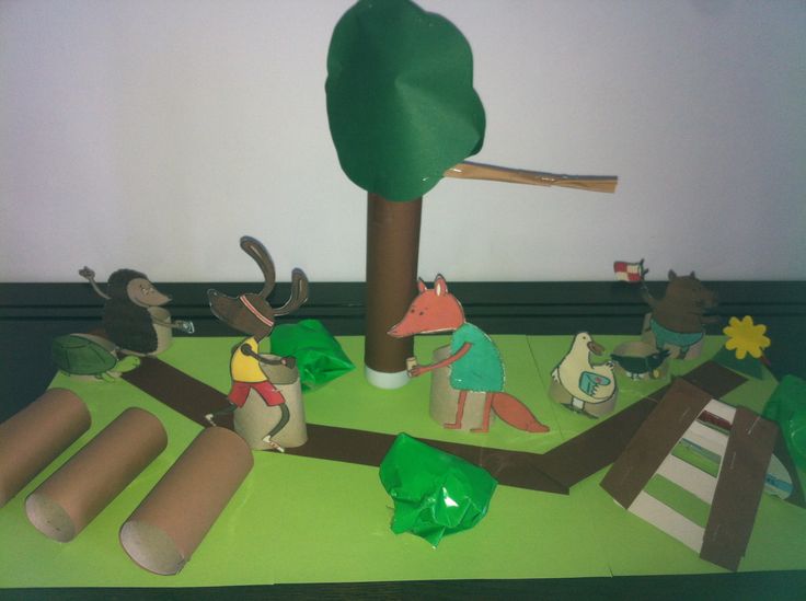 some paper animals and trees on a table