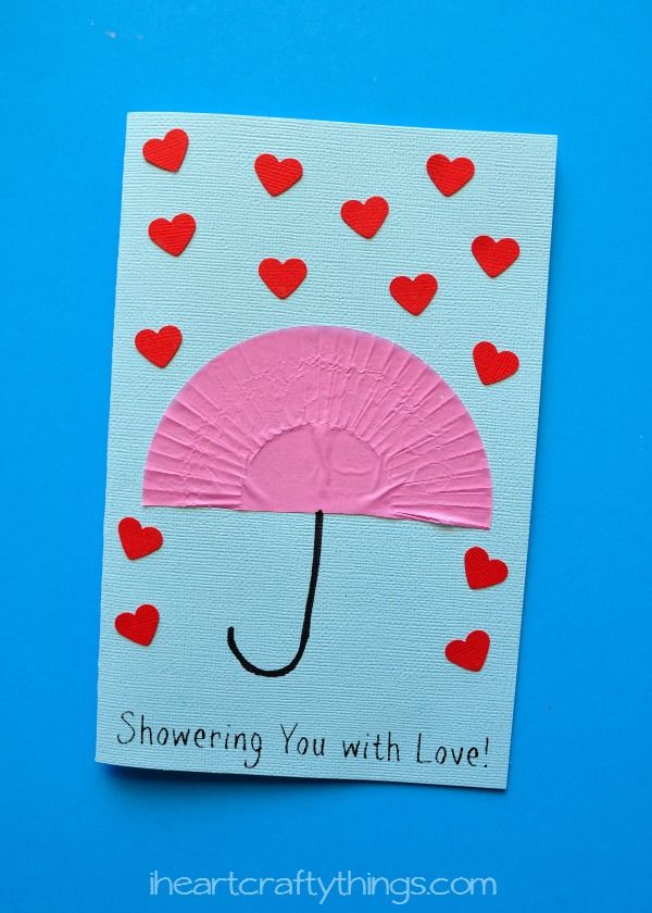 an umbrella with hearts on it and the words showering you with love