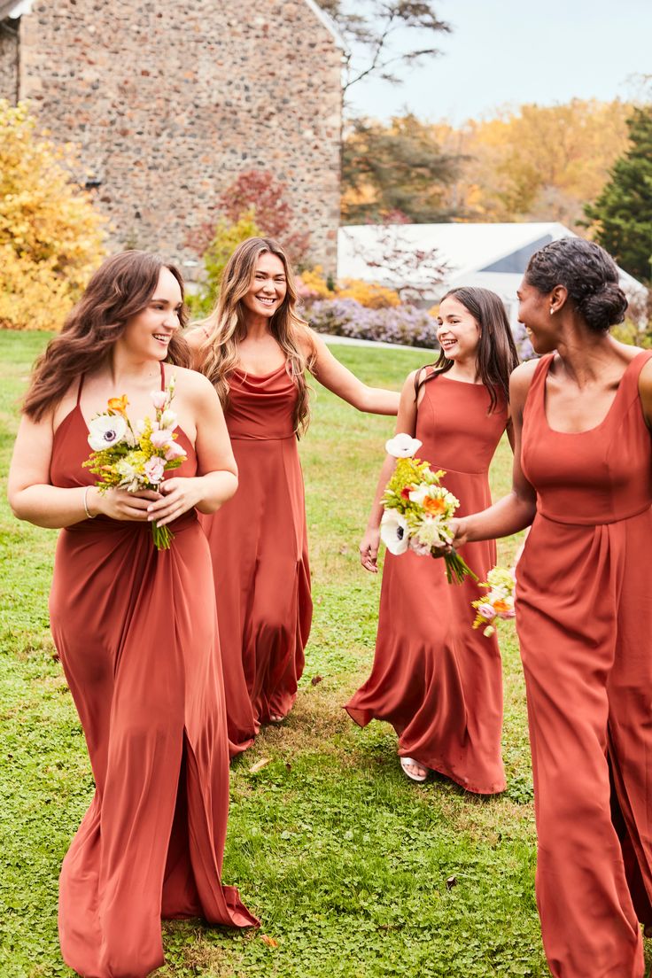 the bridesmaids are all wearing red dresses