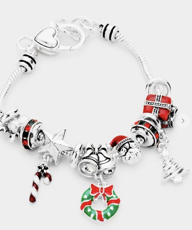 This beautiful Christmas-themed charm bracelet has an elegant look to it and is a fun detail to any outfit. Christmas Party Adjustable Charm Bracelet, Christmas Charm Bracelet Gift, Christmas Gift Charm Bracelet, Christmas Holiday Bracelet Jewelry, Christmas Holiday Jewelry Bracelet, Adjustable Charms Charm Bracelet For Party, Christmas Gift Bracelet Jewelry, Adjustable Christmas Jewelry For Holiday, Holiday Festive Jewelry Bracelet