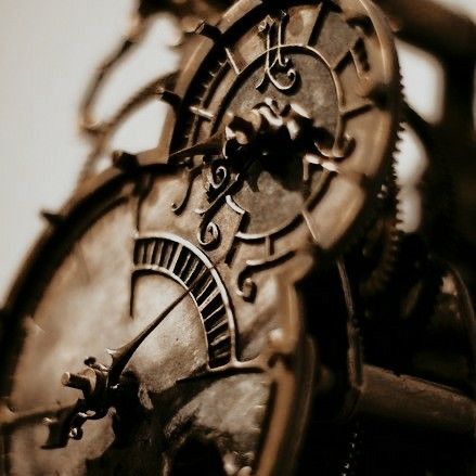 an old clock with roman numerals on it's face is shown in sepia