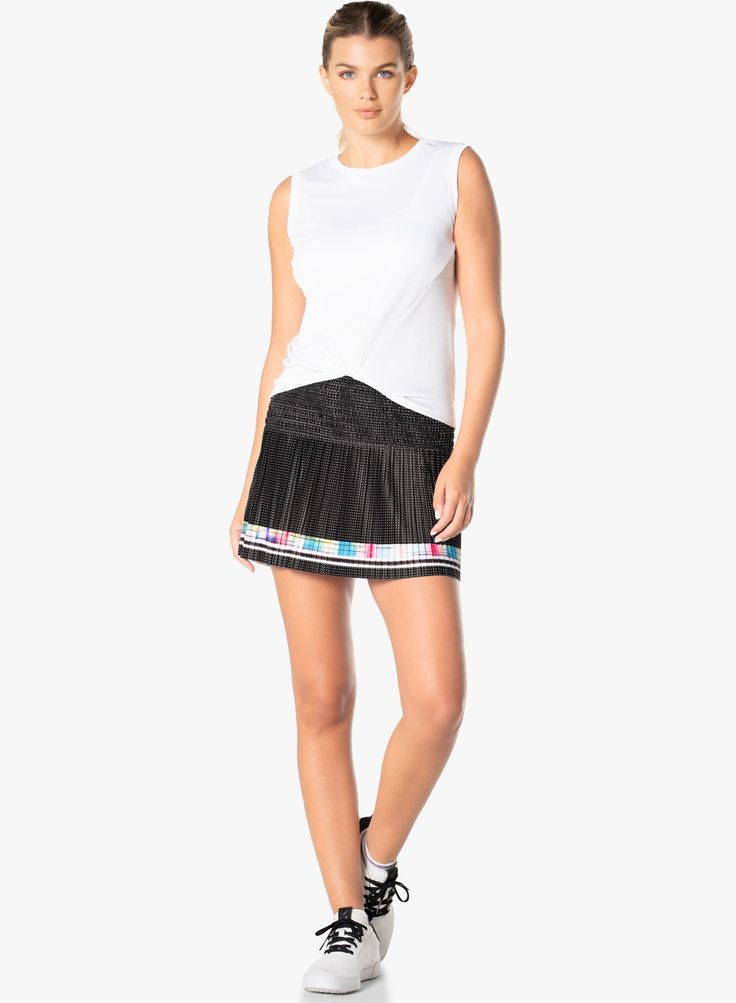 Court couture that bring contemporary styling to tennis in this performance smocked skirt. Done in an ultra lightweight performance fabric it also features a mesh polka dot print, bold ombre racing stripe border and a contrast parrot blue shortie for a pop of color as you move across the court. Summer Athleisure Pleated Skirt, Spring Black Tennis Skirt For Sports, Black Tennis Skirt With Elastic Waistband For Spring, Spring Skirted Sporty Tennis Dress, Black Summer Athleisure Tennis Skirt, Black Athleisure Tennis Skirt For Summer, Spring Black Tennis Dress, Casual Black Tennis Dress For Spring, Sporty Tennis Dress With Lined Skirt For Summer