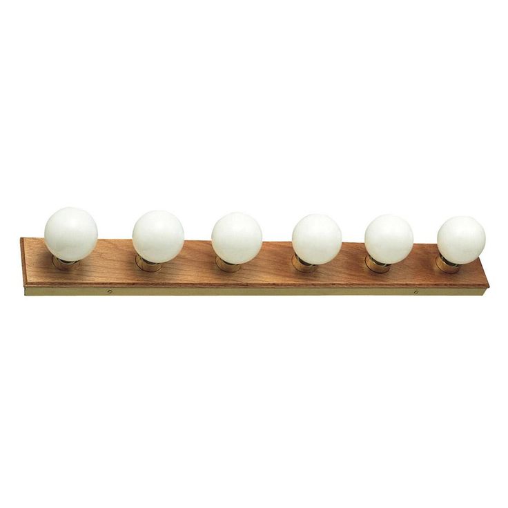 six white balls on a wooden stand