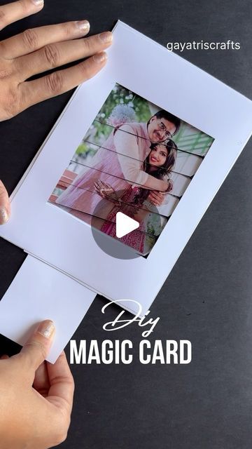 two hands holding an open photo card with the words diy magic card