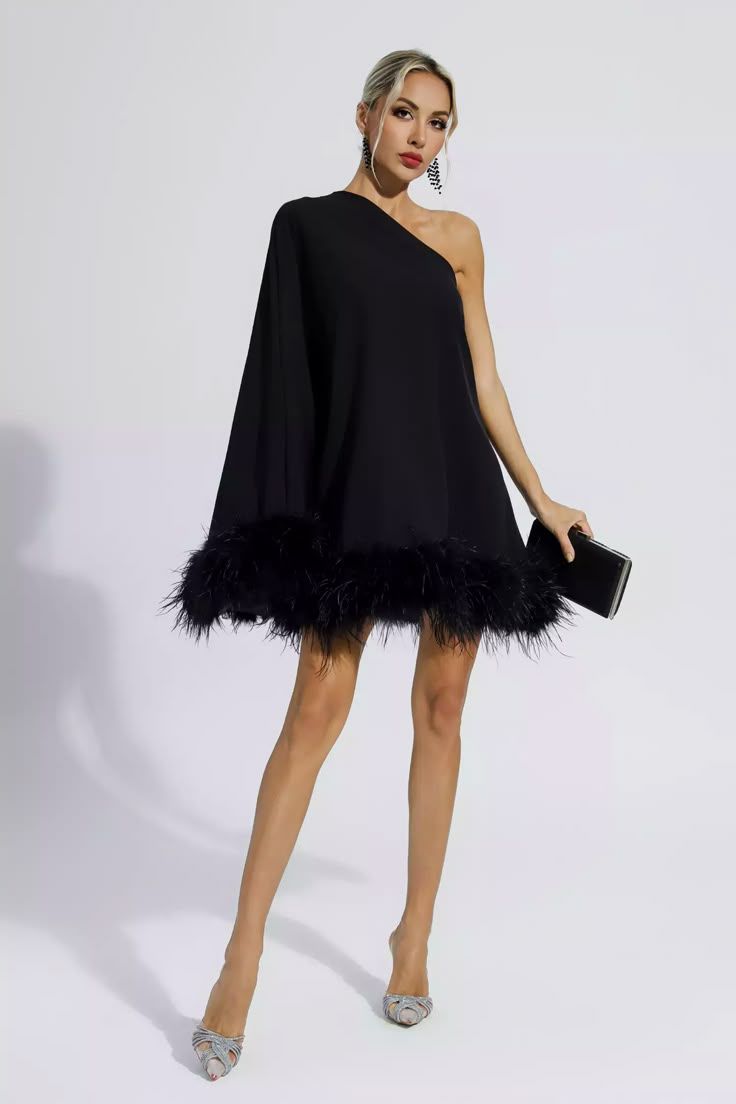 Add cuteness and elegance to your wardrobe with the Ailani Black Feather Trim One Shoulder Mini Dress! The one-shoulder style design with long sleeves adds a sense of fashion and luxury. The skirt is dotted with feathers, which look fluffy and adorable. Wear heels or boots to create a look that's unique to you. Perfect for cocktails or parties.  Dress Length: Approx 90cm Materials: 70% Polyester, 30% Cotton Gentle Dry Clean Only  Model is 5 ft 7 and wears size S  Colour may vary due to lighting One Shoulder Mini Dress, Feather Trim, Estilo Chic, Feather Dress, Feather Design, Black Feathers, Style Chic, Bandage Dress, Outerwear Women