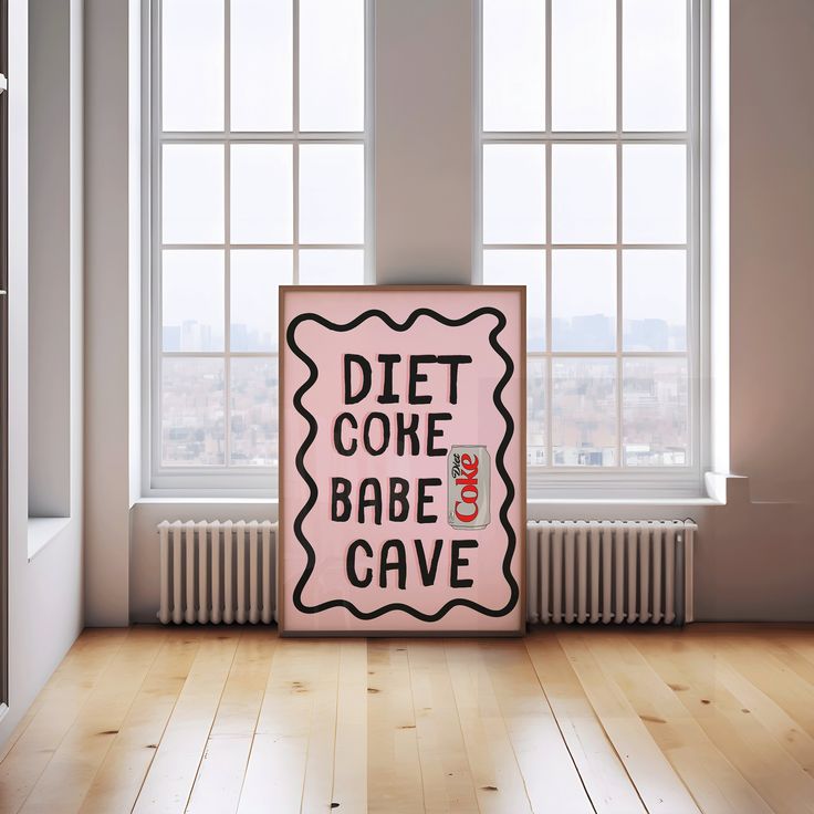 a pink sign that says diet coke babe cave in front of a window with the words diet coke babe cave on it