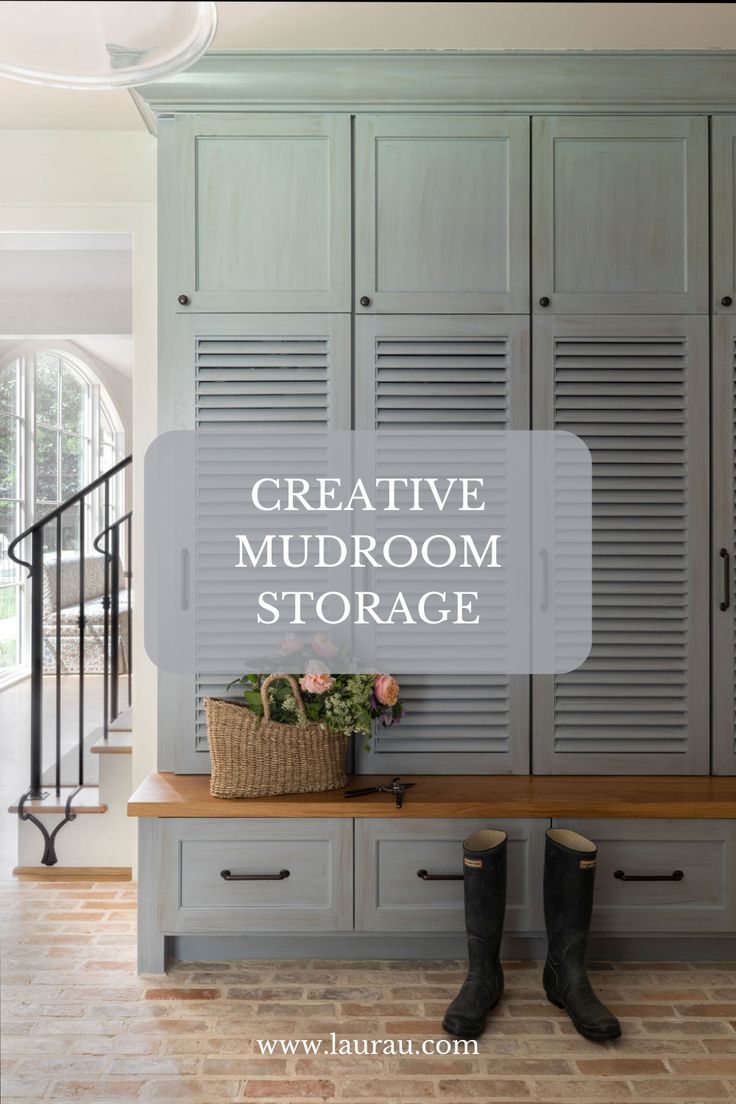 an entryway with gray cabinets and black boots on the bench in front of it