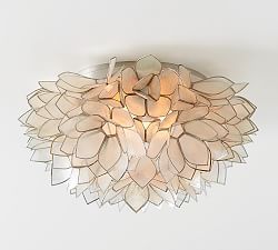 a white ceiling light hanging from the ceiling with petals on it's glass shades