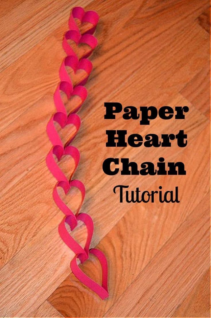 paper heart chain on the floor with text overlay that reads paper heart chain tutor