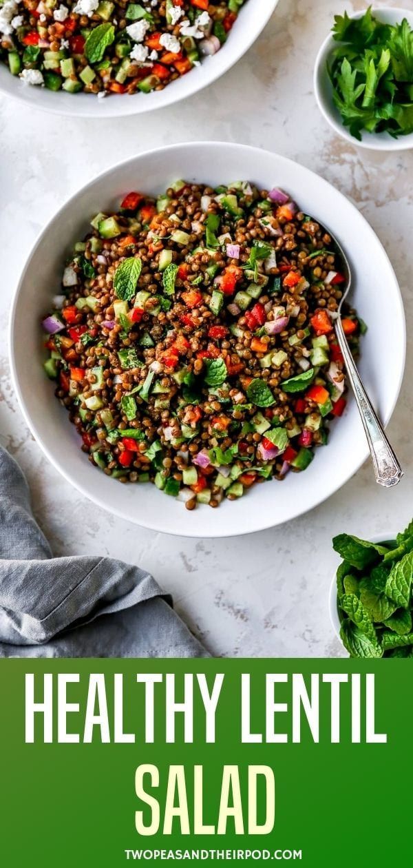 healthy lentil salad with fresh herbs and mints in white bowls on a marble surface