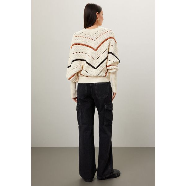 Off-white knit (70% Cotton, 30% Nylon). Sweater. Long sleeves. Crewneck. Pull on. 21" from shoulder to hemline. Imported. White Knit Top For Work In Winter, White Long Sleeve Knit Top For Work, White Pointelle Knit Outerwear, White Long Sleeve Pointelle Knit Outerwear, White Knitted Sweater For Work, White Fall Sweater For Work, Winter White Pointelle Knit Sweater For Fall, Cream Long Sleeve Outerwear With Pointelle Knit, Cream Pointelle Knit Outerwear With Long Sleeves