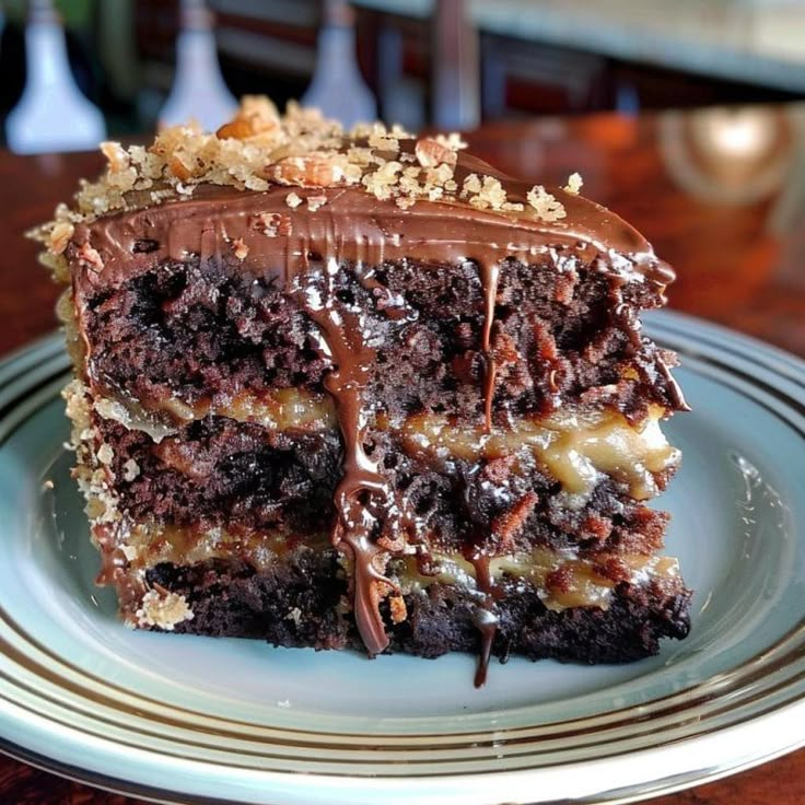 there is a piece of cake on the plate with chocolate frosting and walnuts