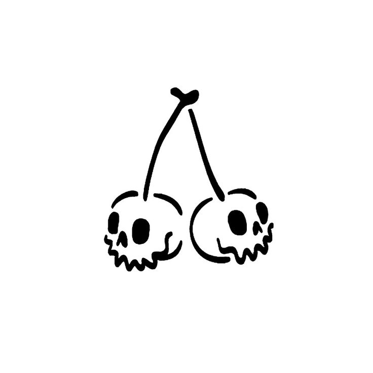 two cherries with skulls drawn on them