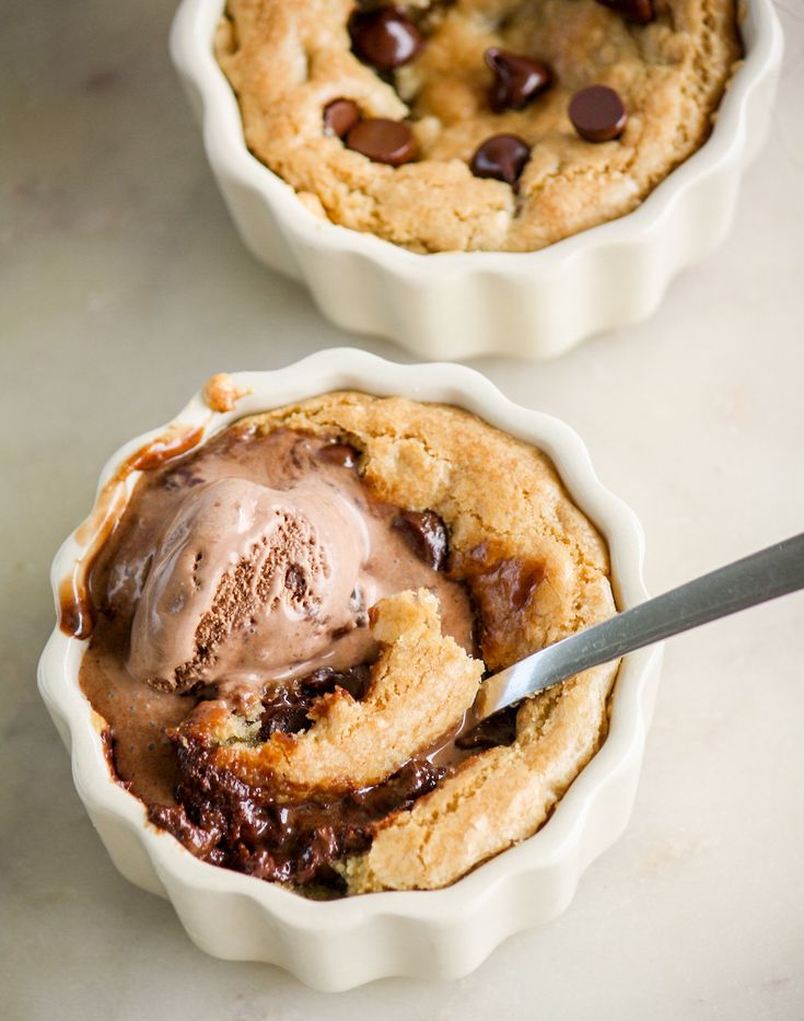 two dessert dishes with ice cream and chocolate chip cookies