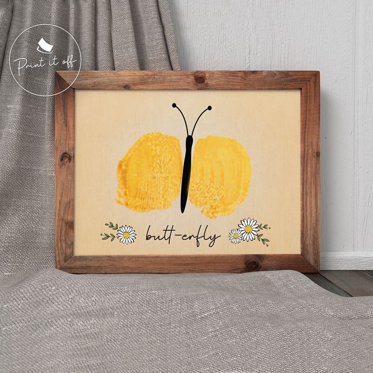 a wooden frame with a yellow butterfly painted on it and the words, butterflies are written in black ink