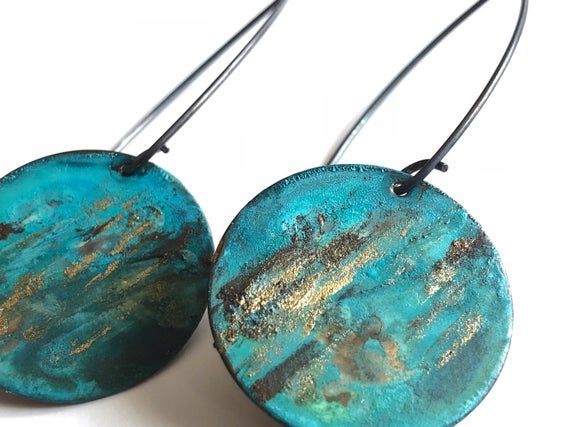 Brass naturally oxidized with Verdigris patina and brown and gold accents.  Hangs from oxidized sterling silver ear wires.Measurement:1”x2”Care:All of our patina pieces are sealed with a resin lacquer to help protect the oxidization, however we do recommend that you keep all patina pieces dry and away from water as it can further the oxidation process and potentially can alter the color. *Patina is a natural oxidation process so color shades may vary. Patina Drop Earrings As Gift, Artisan Earrings With Patina As Gift, Artisan Earrings With Patina For Gifts, Artisan Patina Earrings As A Gift, Bronze Patina Earrings For Gift, Unique Green Jewelry With Patina, Artsy Bronze Jewelry With Patina, Adjustable Multicolor Patina Jewelry, Unique Multicolor Patina Jewelry