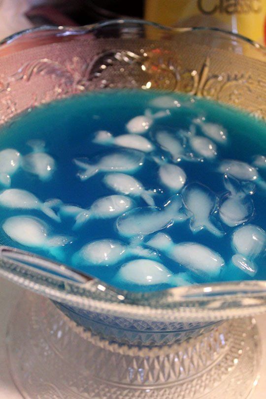 a blue liquid in a glass bowl on a table