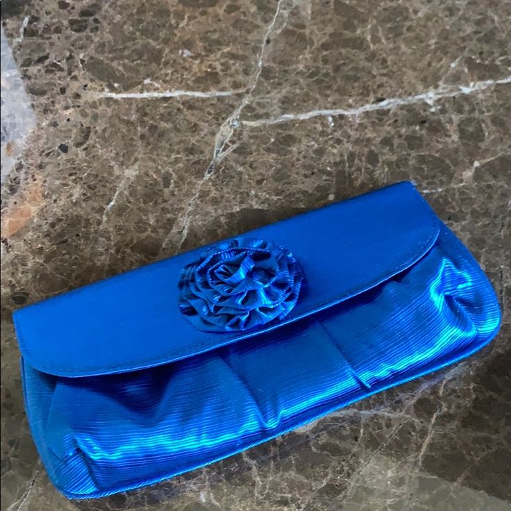 Brand New Evening Bag/Clutch In Blue With Flower On Top. Short Silver Chain To Use As Bag Blue Evening Bag With Removable Pouch For Party, Blue Clutch With Removable Pouch For Party, Blue Party Clutch With Removable Pouch, Elegant Blue Shoulder Bag Clutch, Blue Pouch Evening Bag, Blue Evening Bags With Removable Pouch, Elegant Blue Shoulder Bag For Events, Blue Rectangular Shoulder Bag For Events, Elegant Blue Clutch Shoulder Bag