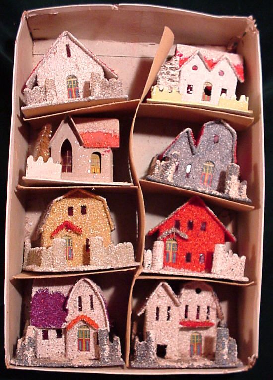 a cardboard box filled with lots of small houses