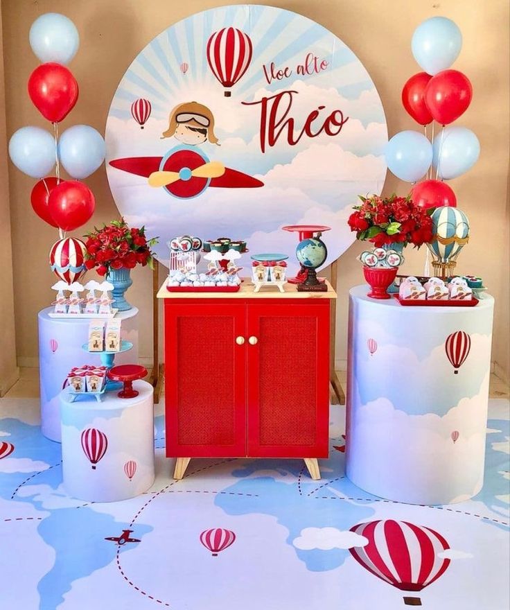 a table with balloons and decorations for a children's birthday or other special occasion