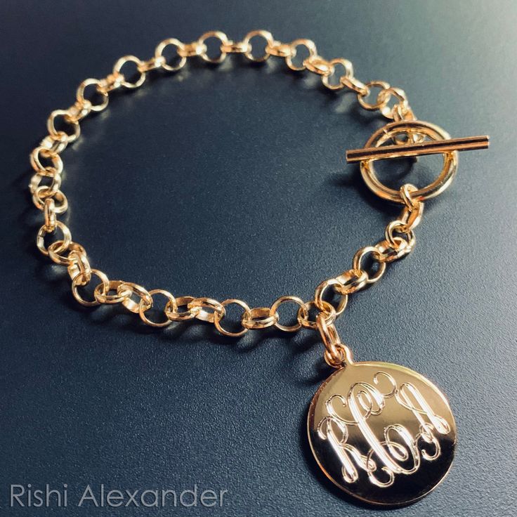 "Rishi Alexander offers Handmade, Up-Scale Jewelry and Gifts. For many of our Unique items, we offer Personalized Monograms that are done by our own in house Engravers. Each Buyer will get a brand new .925 Sterling Silver Toggle Link Charm Bracelet with a Gold Finish! This is absolutely the perfect starter charm bracelet. Why not have your first charm be a monogrammed one! Add more charms to this bracelet or rock it proudly with your own monogram. We do custom monograms for each Jewelry Item so Gold Bar Bracelet, Monogram Bracelet, Silver Monogram, Cowgirl Jewelry, Monogram Jewelry, Gold Monogram, Bridesmaid Bracelet, Initial Bracelet, Fine Jewelry Bracelets