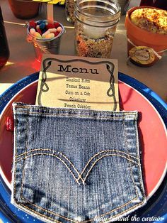 a blue plate topped with a jean pocket