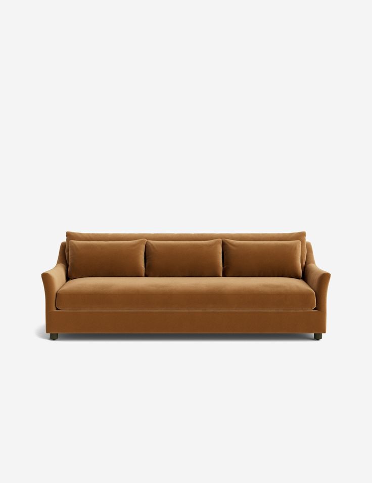 a brown couch with pillows on it