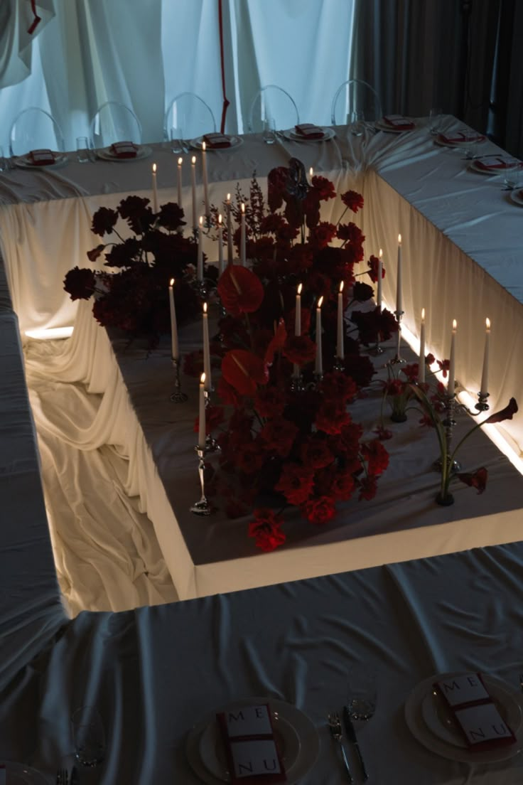 a table with candles and flowers on it