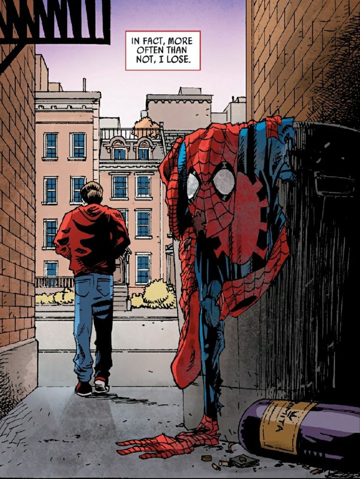 a man standing next to a giant spiderman