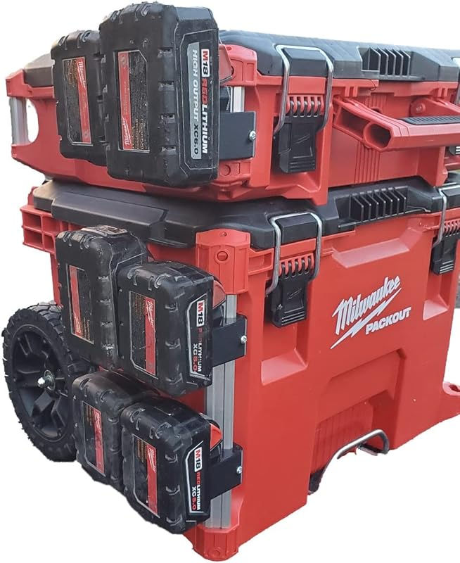 two milwaukee tool boxes stacked on top of each other with tools in the bottom compartment