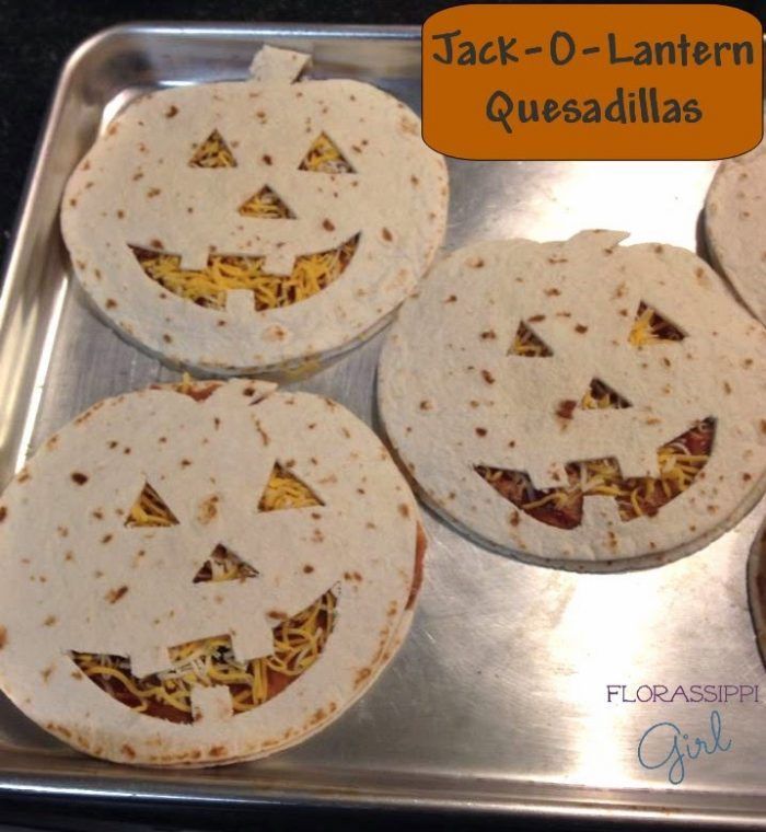 four tortillas with jack - o'- lantern faces on them sitting in a pan