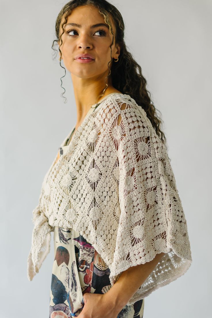 Introducing the Arata Crochet Cardigan, your new favorite piece for those breezy spring days. Made with a natural color and a playful crochet pattern, this cardigan is perfect for layering and adding a unique touch to any outfit. Stay stylish and comfortable with the Arata Cardigan! Details self: 100% cotton lining: 100% rayon Fabric Care Guide Here Sizing & Fit Measurements are approximate and taken while laying flat across the front. Not doubled. small: bust =36"; length = 12" medium: bust = 4 Bohemian Cream Crochet Top With Crochet Trim, Bohemian Cream Crochet Top For Spring, Bohemian Crochet V-neck Cardigan, Bohemian V-neck Crochet Cardigan, Cream Knit Cardigan For Beach, Cream Knit Cardigan For The Beach, Fall Crochet Top For A Day Out, Cream Open Knit Cardigan For Beach, Beige Knit Cover-up For Spring