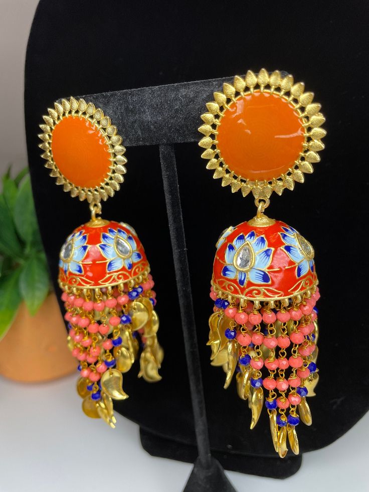 Grab these fun and peppy earrings for a statement look! They come in two colors and are perfect to wear with a dress during the day or a night out as well! Bridal Indian Jewelry, Long Jhumka, Indian Jhumka, Meenakari Earrings, Bridal Indian, Semi Precious Earrings, Pakistani Bridal Jewelry, Hand Painted Necklace, Simple Bangle