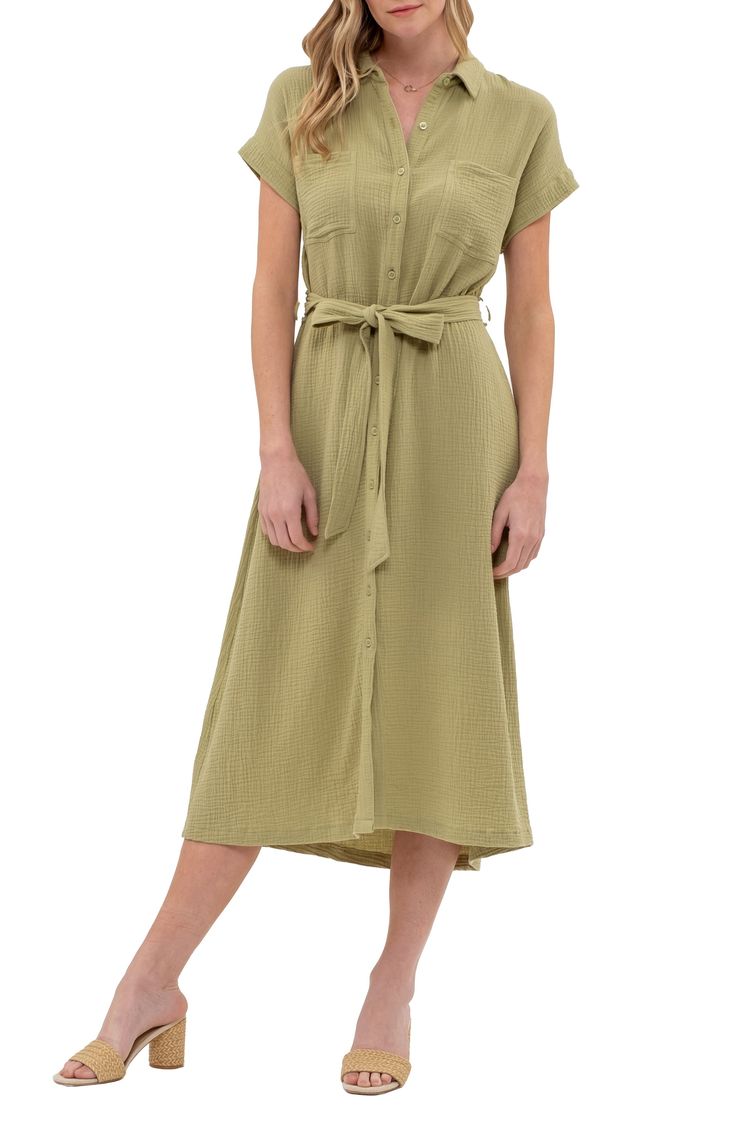 Feel your finest in this contemporary midi shirtdress featuring a button front closure and soft waist belt. 48 1/2" length Spread collar Front button closure Chest patch pockets Removable waist tie 100% cotton Hand wash, dry flat Imported Spring Midi-length Belted Dress With Pockets, Summer Button-up Belted Dress With Buttons, Summer Cotton Belted Dress With Tie Waist, Summer Cotton Shirt Dress With Belted Cuffs, Belted Cotton Shirt Dress For Spring, Spring Casual Belted Dress With Tie Fastening, Spring Cotton Belted Shirt Dress, Spring Solid Color Belted Maxi Dress, Spring Midi-length Belted Dress With Tie Fastening