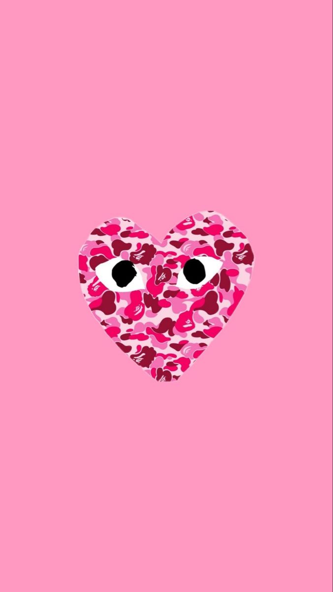 a heart made out of pink camo on a pink background with eyes in the middle