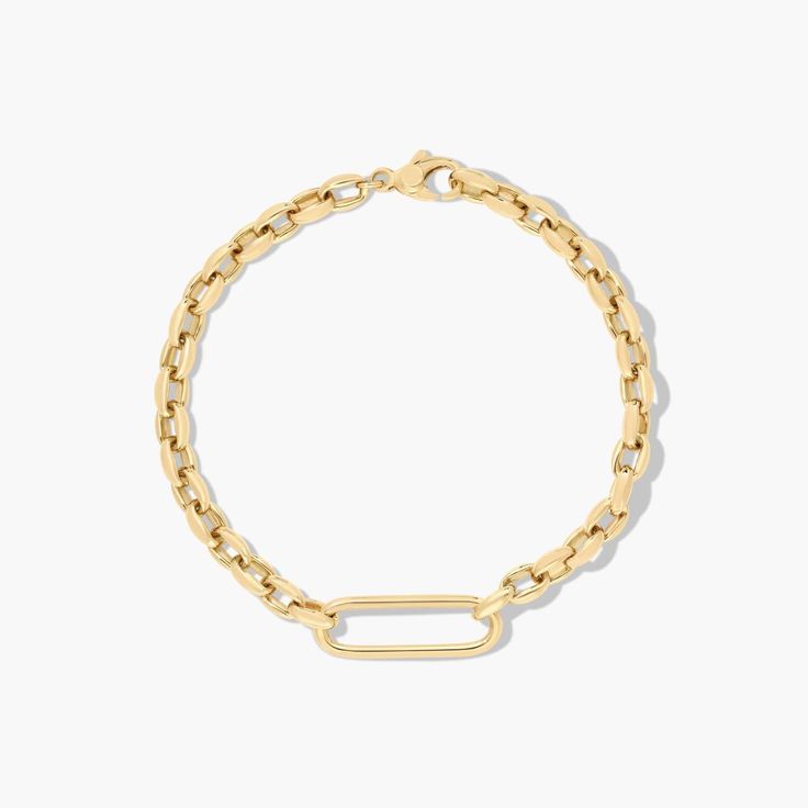 14K Yellow Gold Golden Hour Elongated Oval Link Bracelet. This oval link bracelet features a fancy shape chain with a paperclip detail that makes it as unique as it is stylish. A truly modern piece, wear it alone to show it off or layer it for maximum style. Pair it with the matching necklace for seamless shine. Modern Paperclip Bracelet With Cable Chain For Formal Occasions, Modern Gold Chain Oval Bracelet, Modern Oval Gold Chain Bracelet, Minimalist Gold-tone Paperclip Bracelet With Oval Links, Modern Gold-tone Link Paperclip Bracelet, 14k Gold Oval Link Paperclip Bracelet, Modern Oval Gold Bracelet For Everyday, Classic Oval Bracelets With Paperclip Chain, Luxury Paperclip Bracelet With Oval Link For Everyday