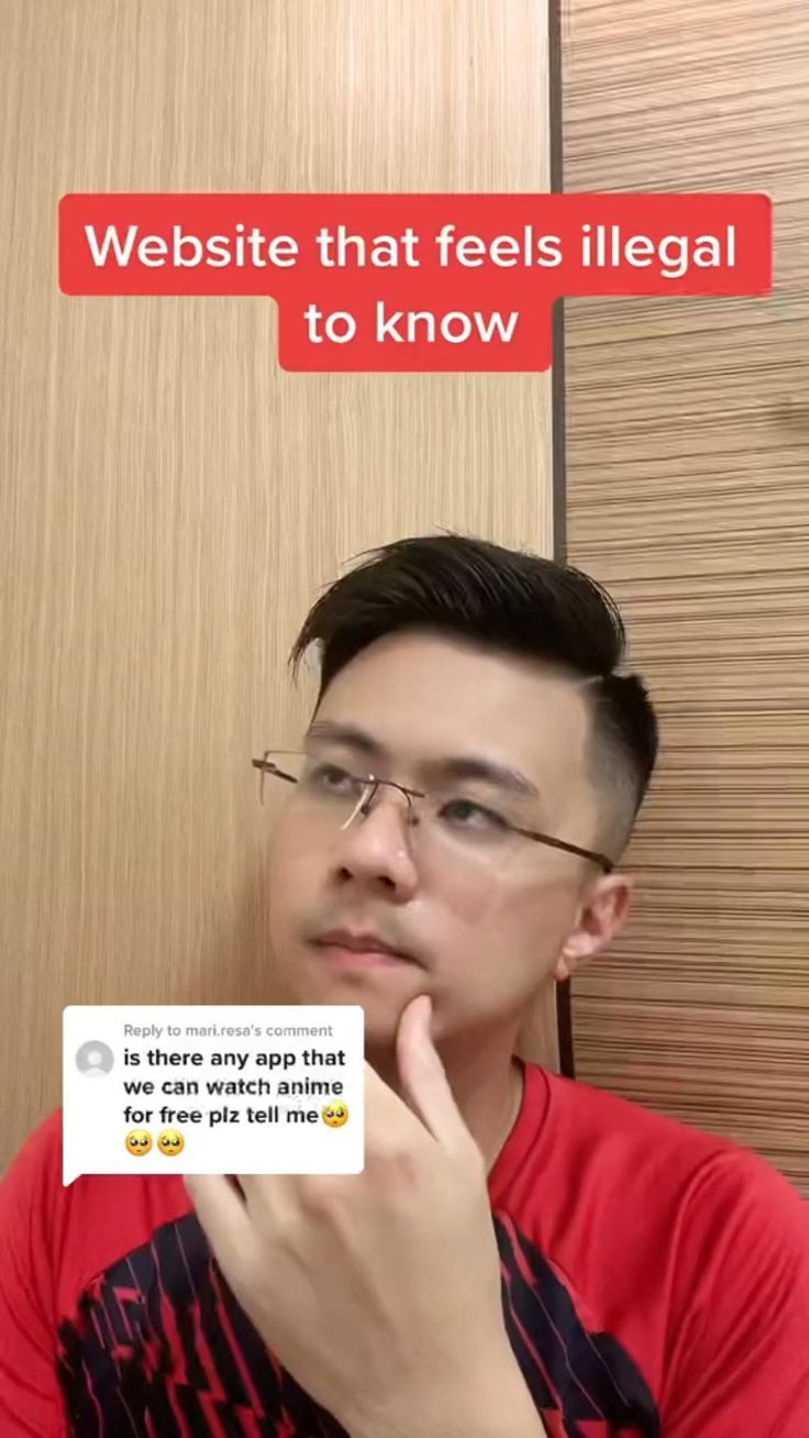 a man with glasses is looking at his cell phone and has the words website that feels illegal to know