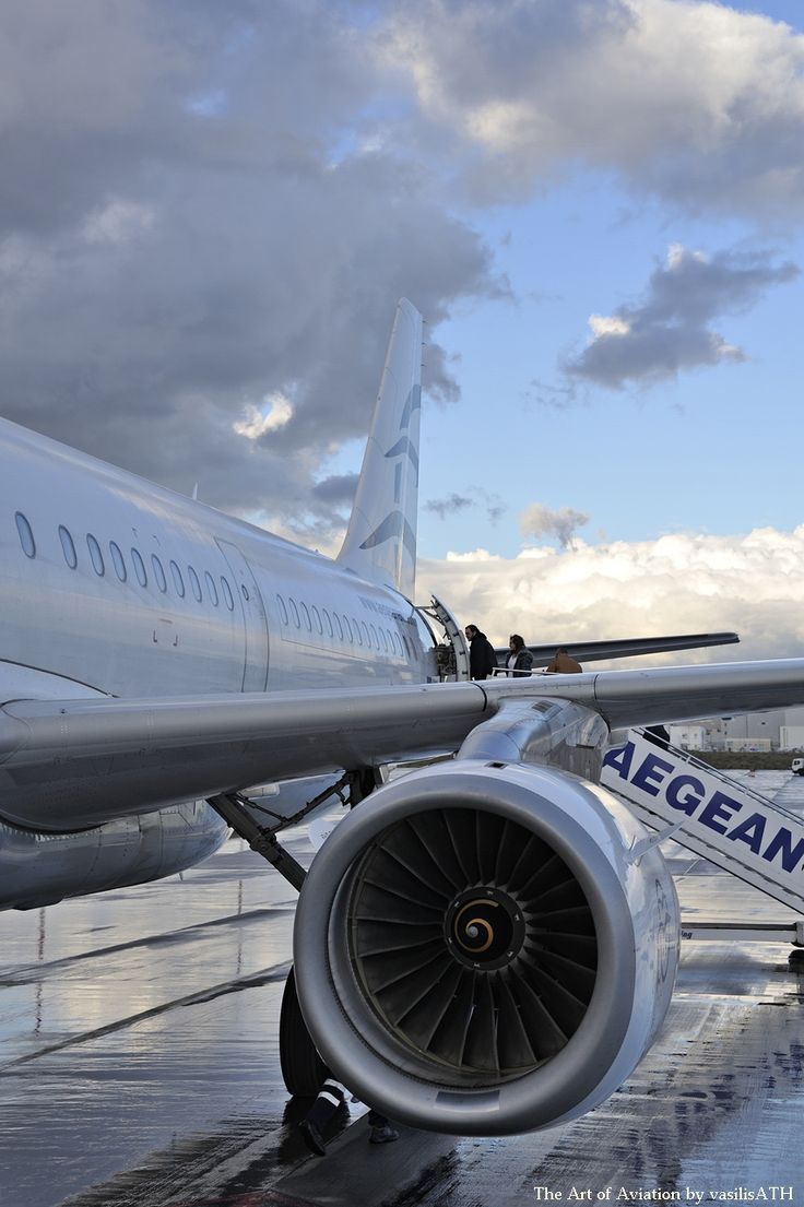 an airplane is sitting on the tarmac with its wheels down